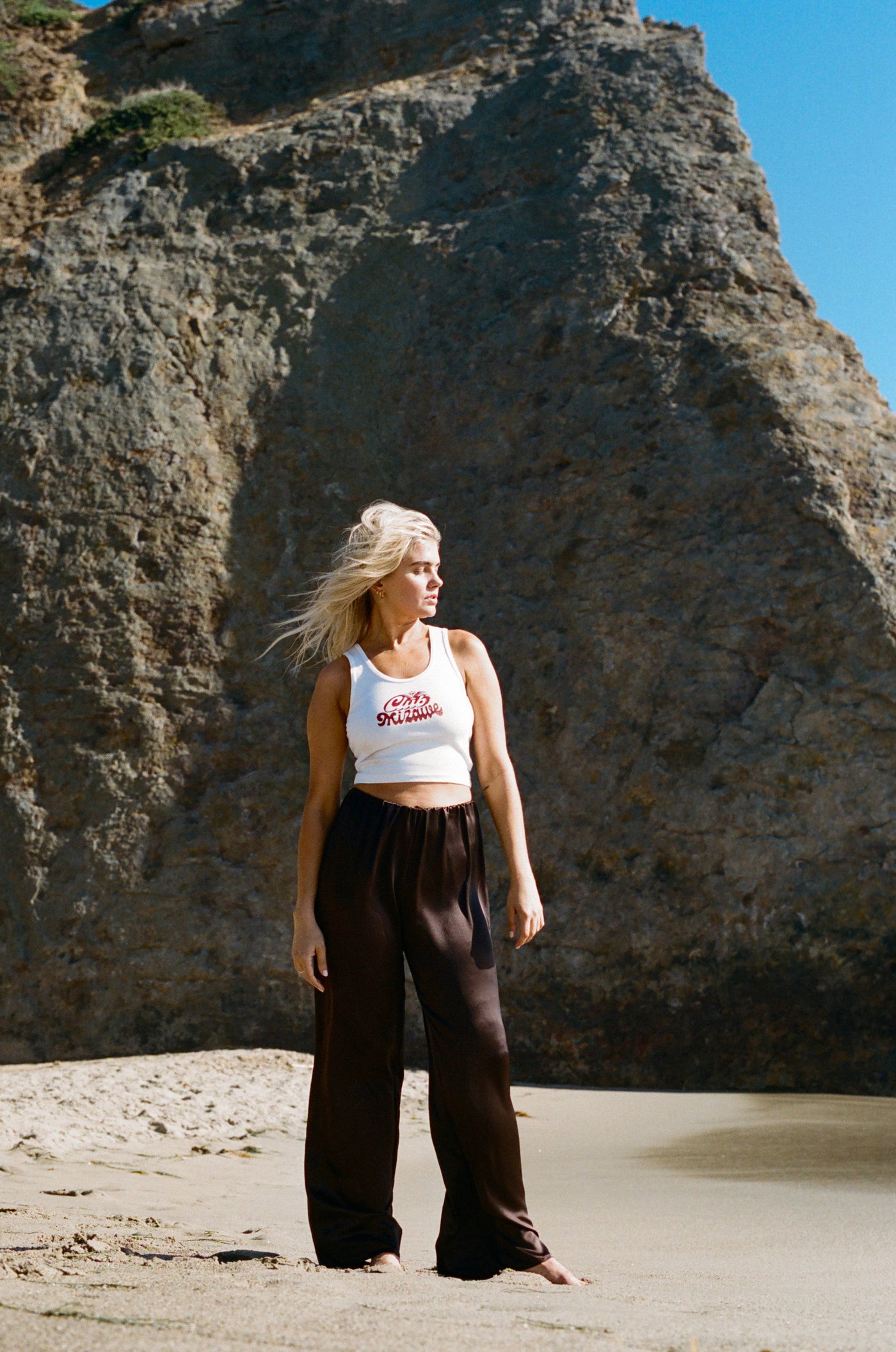 girl at the beach wearing club mizawe tank