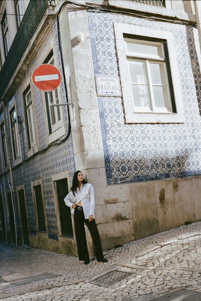 girl wearing button up shirt and brown pants