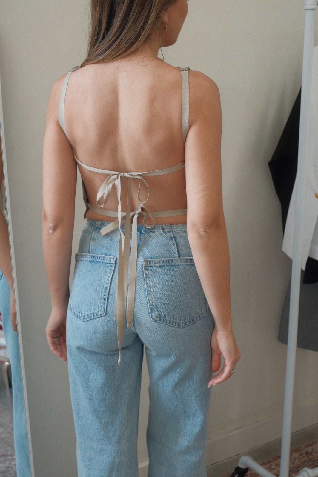 girl wearing melrose backless leather top 