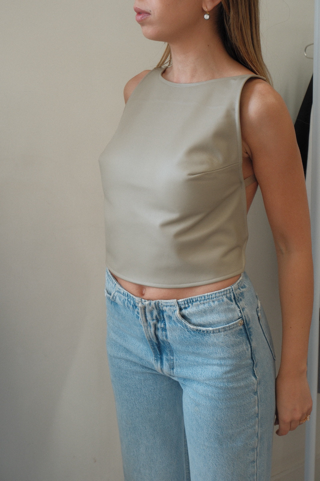 girl wearing melrose backless leather top 