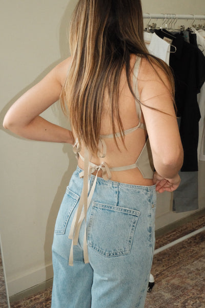 girl wearing melrose backless leather top 