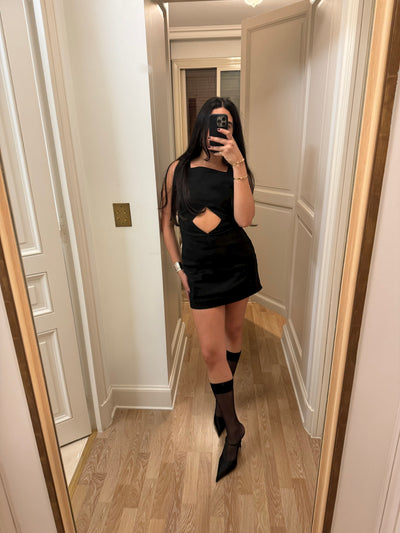 girl wearing pellicano mini dress in black