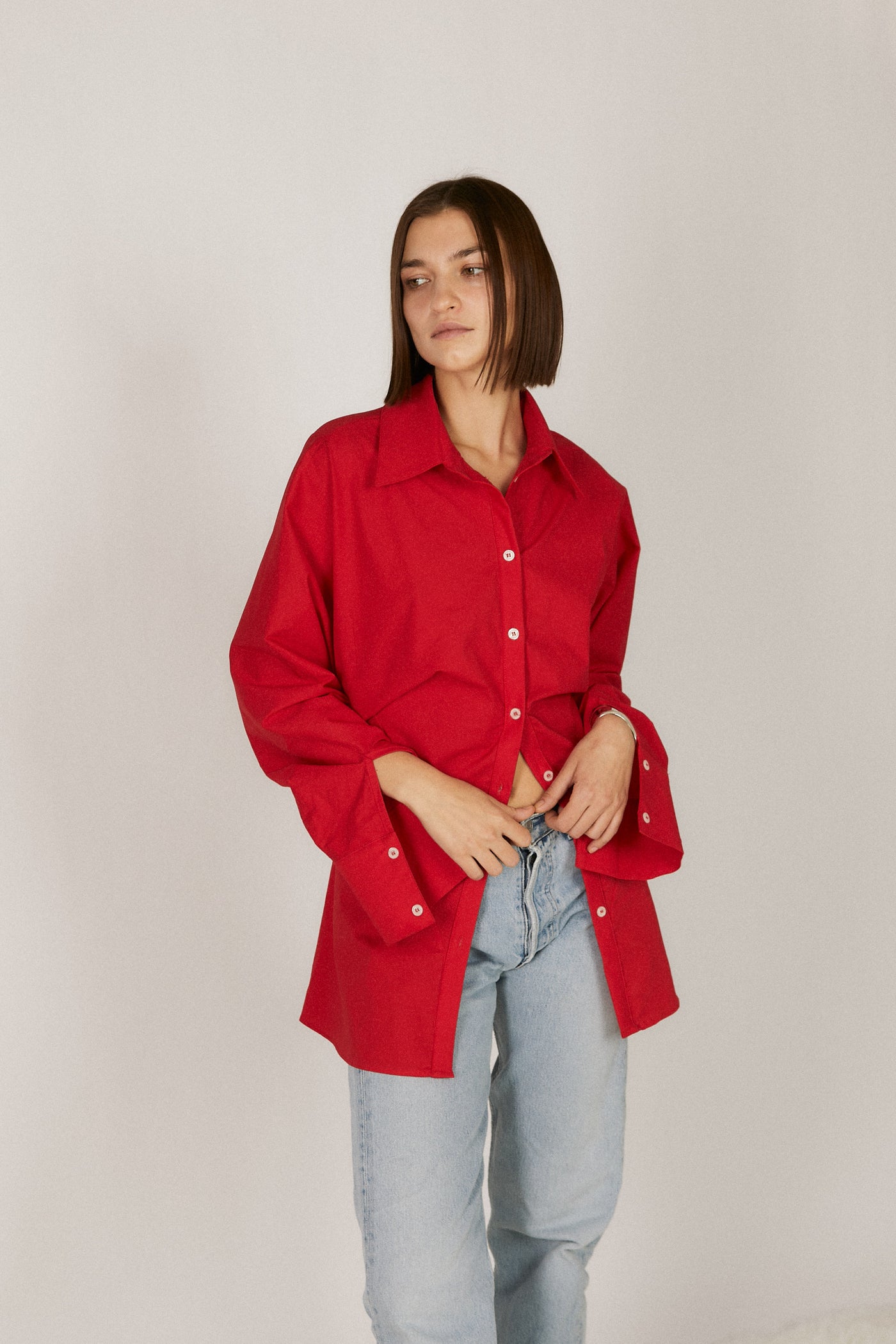 girl wearing faro cinched button up shirt in red