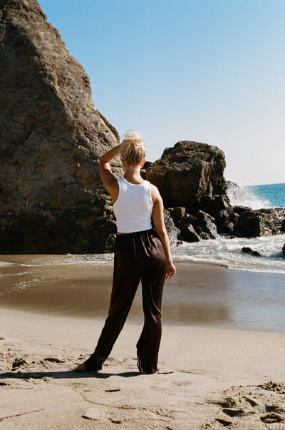 girl wearing roma silk pants in chocolate brown