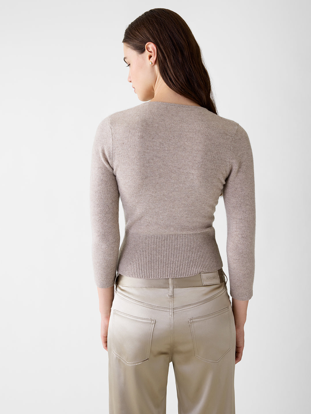 Back view of a khaki cashmere sweater with three-quarter sleeves and a fitted ribbed waist.