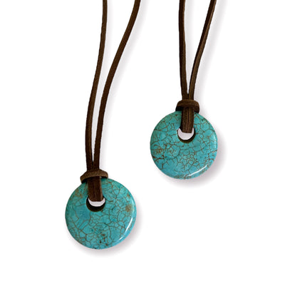 turquoise pendants on brown leather cord
